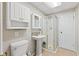 Bathroom with standing shower, toilet, and pedestal sink at 7 Lake Hart, Mooresville, IN 46158