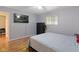 Bedroom featuring hardwood floors, a fan, and neutral paint at 7 Lake Hart, Mooresville, IN 46158