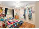 bedroom featuring hardwood floors, a ceiling fan, and playful decor at 7 Lake Hart, Mooresville, IN 46158