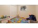 Neutral bedroom with hardwood floors, large window, and a spacious closet at 7 Lake Hart, Mooresville, IN 46158