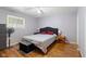 Bedroom featuring hardwood floors, a fan, and neutral paint at 7 Lake Hart, Mooresville, IN 46158