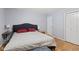 Bedroom featuring hardwood floors, a fan, and neutral paint at 7 Lake Hart, Mooresville, IN 46158