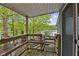Wooden deck overlooking the lake with railing detail and ample space for outdoor seating at 7 Lake Hart, Mooresville, IN 46158