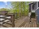 Rustic wooden deck with a view of the lake and access to the house at 7 Lake Hart, Mooresville, IN 46158