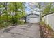 Cozy home featuring a one-car garage, basketball hoop and a private driveway surrounded by mature trees at 7 Lake Hart, Mooresville, IN 46158
