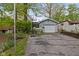 Cozy home featuring a one-car garage, basketball hoop and a private driveway surrounded by mature trees at 7 Lake Hart, Mooresville, IN 46158