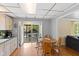 Well-lit kitchen features a table with chairs, a window and sliding glass door leading to a patio outdoors at 7 Lake Hart, Mooresville, IN 46158
