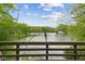 Scenic lake view from the property, surrounded by lush greenery and blue skies at 7 Lake Hart, Mooresville, IN 46158