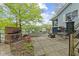 Charming patio with brick grill, outdoor fireplace, and pond feature, perfect for entertaining at 7 Lake Hart, Mooresville, IN 46158