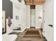 Bathroom with a shower, white subway tile, and wood ceiling beams at 735 Lexington Ave # Apt 27, Indianapolis, IN 46203