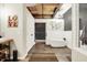 Stylish bathroom featuring a freestanding tub, exposed beam ceiling, and modern decor and fixtures at 735 Lexington Ave # Apt 27, Indianapolis, IN 46203