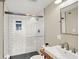 Modern bathroom with white subway tile shower, glass door, and stylish sink at 735 Lexington Ave # Apt 27, Indianapolis, IN 46203