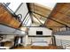 Upstairs bedroom loft with skylights, exposed beam ceiling, a ceiling fan and closet with custom organization at 735 Lexington Ave # Apt 27, Indianapolis, IN 46203