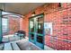Building entrance with brick facade, seating, and secure entry system welcomes residents and guests at 735 Lexington Ave # Apt 27, Indianapolis, IN 46203