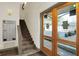 Well-lit entryway showcases mailboxes, stairs, and a glimpse of the outdoors through glass doors at 735 Lexington Ave # Apt 27, Indianapolis, IN 46203