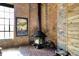Stylish fireplace with brick surround creates a cozy focal point in this unique space at 735 Lexington Ave # Apt 27, Indianapolis, IN 46203