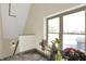 Hallway with staircase, window and plants at 735 Lexington Ave # Apt 27, Indianapolis, IN 46203