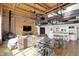 Open-concept living space with modern furnishings and loft area featuring a gourmet kitchen at 735 Lexington Ave # Apt 27, Indianapolis, IN 46203