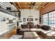 Open-concept living room with loft features modern decor and an inviting atmosphere at 735 Lexington Ave # Apt 27, Indianapolis, IN 46203