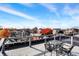 Rooftop deck with seating offers scenic city views on a sunny day at 735 Lexington Ave # Apt 27, Indianapolis, IN 46203