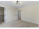 Bedroom with carpet and door to closet. Features contemporary ceiling light at 7907 Oakdale Ln, Indianapolis, IN 46214