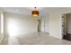 Large bedroom with a light fixture and view of a beautifully tiled bathroom at 7907 Oakdale Ln, Indianapolis, IN 46214