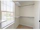 Walk in closet with a window and shelving for organization and storage at 7907 Oakdale Ln, Indianapolis, IN 46214