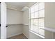 Walk in closet with a window and shelving for organization and storage at 7907 Oakdale Ln, Indianapolis, IN 46214