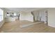 Bright and airy open living space with light wood floors flowing into the adjacent kitchen area at 7907 Oakdale Ln, Indianapolis, IN 46214