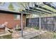 A serene backyard featuring a pergola, stone pathway, garden and brick home exterior at 8049 Burn Ct, Indianapolis, IN 46217