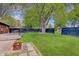 Expansive backyard with lush lawn, mature tree, privacy fence, and outdoor living space at 8049 Burn Ct, Indianapolis, IN 46217