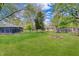 Backyard featuring a lush lawn, fire pit, and fenced-in area, great for outdoor enjoyment at 8049 Burn Ct, Indianapolis, IN 46217