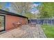 Relaxing backyard with a wooden deck, outdoor seating, and lush green lawn at 8049 Burn Ct, Indianapolis, IN 46217