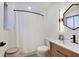 Bathroom features modern fixtures, vanity, and a shower with a curtain at 8049 Burn Ct, Indianapolis, IN 46217
