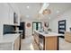 Well-lit kitchen with a large island, modern appliances, and a functional layout for cooking and dining at 8049 Burn Ct, Indianapolis, IN 46217