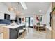 Bright kitchen featuring island with seating, modern cabinets, and a cozy breakfast nook at 8049 Burn Ct, Indianapolis, IN 46217