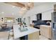 Bright kitchen with an island, quartz countertops, stylish cabinets, and stainless steel appliances at 8049 Burn Ct, Indianapolis, IN 46217