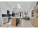 Modern kitchen with a large island, stainless steel appliances, and a skylight for natural light at 8049 Burn Ct, Indianapolis, IN 46217