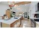 Spacious kitchen showcasing an island, pendant lighting, and an open design connecting to the living space at 8049 Burn Ct, Indianapolis, IN 46217