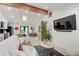 Cozy living room with comfortable seating, a large TV, and an open view to the kitchen at 8049 Burn Ct, Indianapolis, IN 46217
