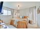Inviting main bedroom with ensuite bath, large window, and stylish furniture at 8049 Burn Ct, Indianapolis, IN 46217