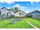 Well-kept backyard featuring metal garden beds and easy access to a small deck at 844 N Emerson Ave, Indianapolis, IN 46219