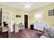 Bright bedroom with a desk area, neutral walls, and a decorative area rug at 844 N Emerson Ave, Indianapolis, IN 46219