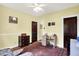 Sunlit bedroom featuring hardwood floors, neutral paint, and a large area rug at 844 N Emerson Ave, Indianapolis, IN 46219