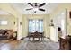 Bright dining area featuring hardwood floors, a ceiling fan, and an open layout for easy entertaining at 844 N Emerson Ave, Indianapolis, IN 46219