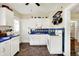 Charming kitchen featuring white cabinets, blue countertops, and a stylish tile backsplash at 844 N Emerson Ave, Indianapolis, IN 46219