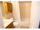Standard bathroom featuring a toilet, shower/tub combo with curtain, and storage at 9718 Jupiter Pass, Carmel, IN 46032