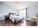 Spacious bedroom with a king-size bed, dark hardwood floors, and plenty of natural light at 9718 Jupiter Pass, Carmel, IN 46032