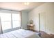 Serene bedroom featuring large windows and a vanity, creating a perfect space for relaxation and self-care at 9718 Jupiter Pass, Carmel, IN 46032