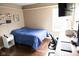 Modern bedroom features hard wood floors, desk, and bright natural light from the double windows at 9718 Jupiter Pass, Carmel, IN 46032